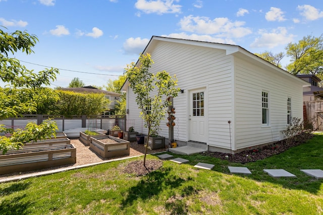 back of property featuring a lawn