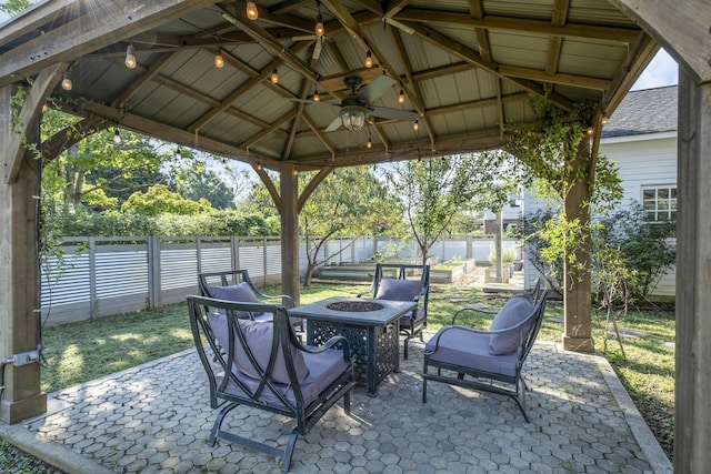 view of patio featuring a fire pit, a gazebo, and ceiling fan