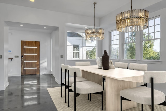 dining area with a wealth of natural light and a notable chandelier