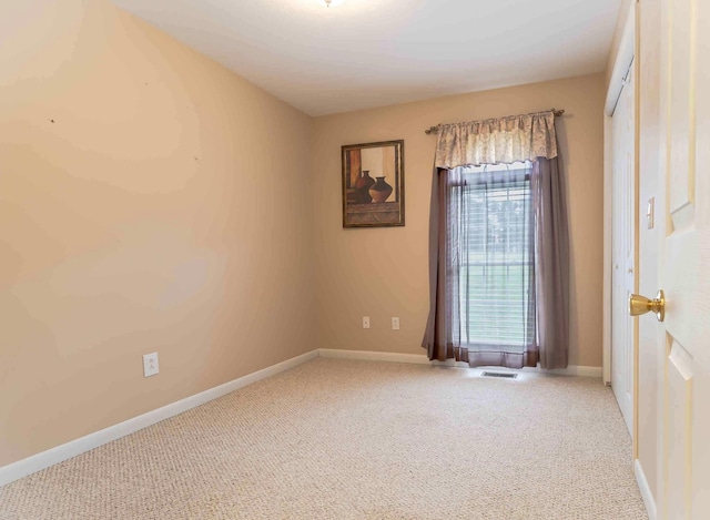 unfurnished room with carpet floors