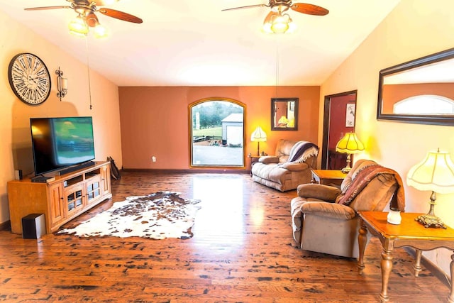 living room featuring lofted ceiling, dark hardwood / wood-style floors, and ceiling fan