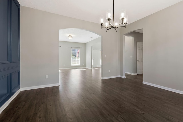 interior space with dark hardwood / wood-style flooring and a notable chandelier