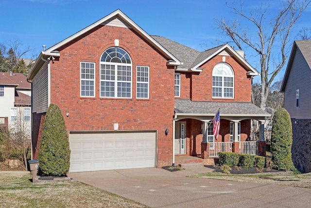 front facade with a garage and covered porch