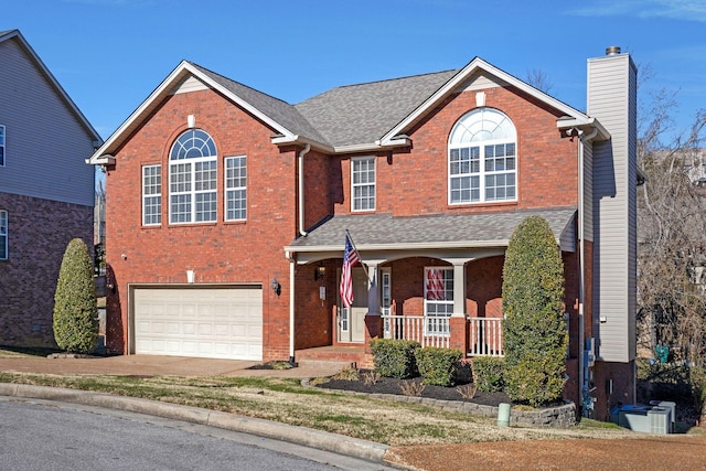 front facade with a garage and covered porch