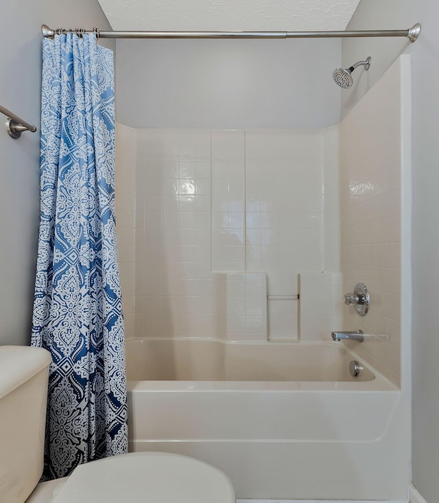 bathroom featuring shower / bath combination with curtain and toilet