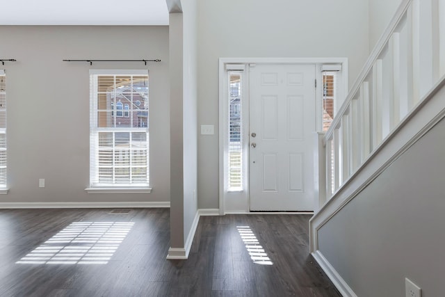 foyer entrance featuring dark hardwood / wood-style floors