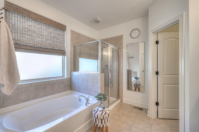 bathroom featuring tile patterned floors and plus walk in shower