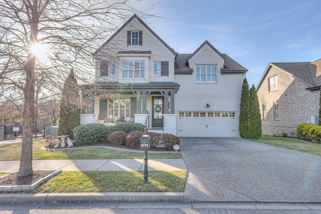 view of front of house with a garage and a front yard