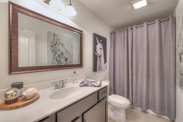 bathroom with tile patterned flooring, vanity, a shower with shower curtain, and toilet