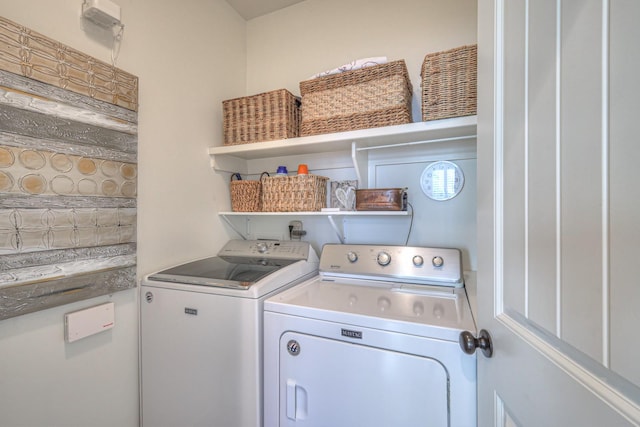 laundry area with independent washer and dryer