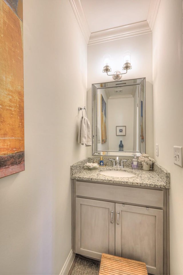 bathroom with vanity and crown molding