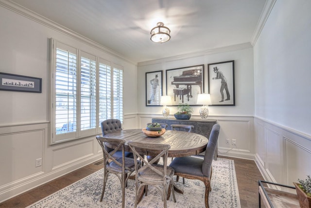 dining space with ornamental molding and dark hardwood / wood-style flooring