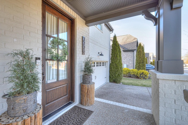 view of exterior entry with a garage