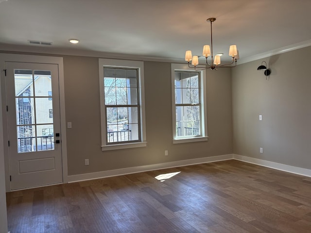 interior space with visible vents, baseboards, dark wood-style floors, crown molding, and a notable chandelier