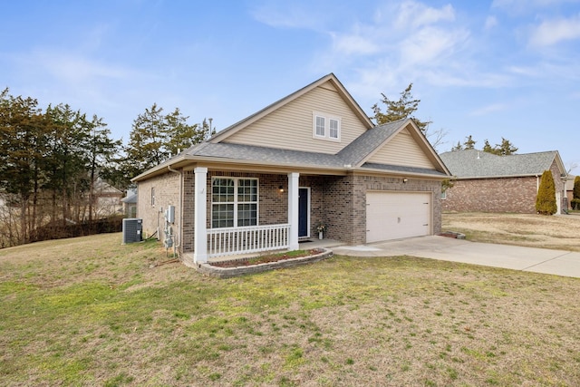 view of front facade with a front yard, a garage, cooling unit, and covered porch