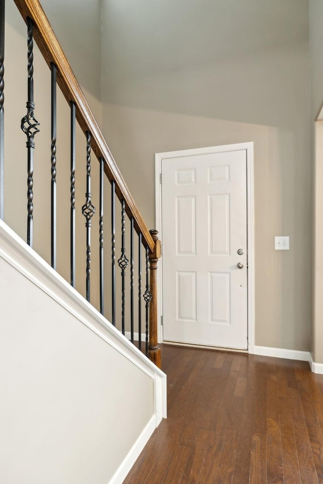 foyer entrance with dark hardwood / wood-style flooring