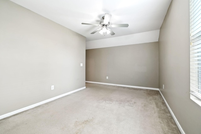 unfurnished room with carpet flooring and ceiling fan