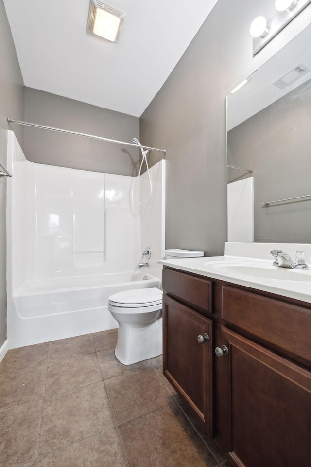 full bathroom with tile patterned flooring, vanity, bathing tub / shower combination, and toilet