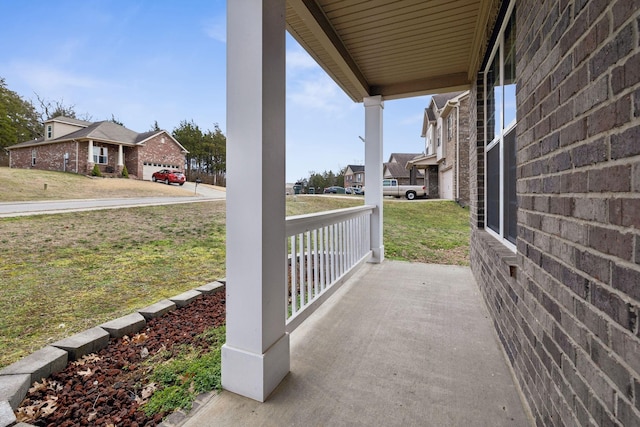 view of patio with a garage and covered porch