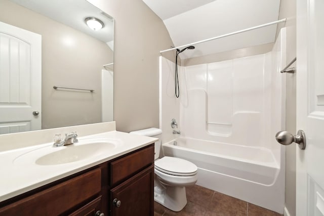 full bathroom featuring vanity, tile patterned floors, toilet, and shower / washtub combination