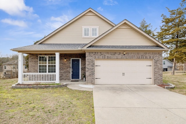 view of front of home with a garage, a porch, and a front lawn