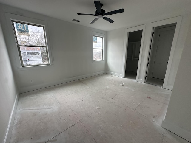 unfurnished bedroom featuring ceiling fan