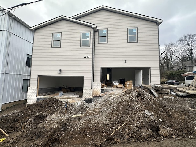 view of side of home featuring a garage