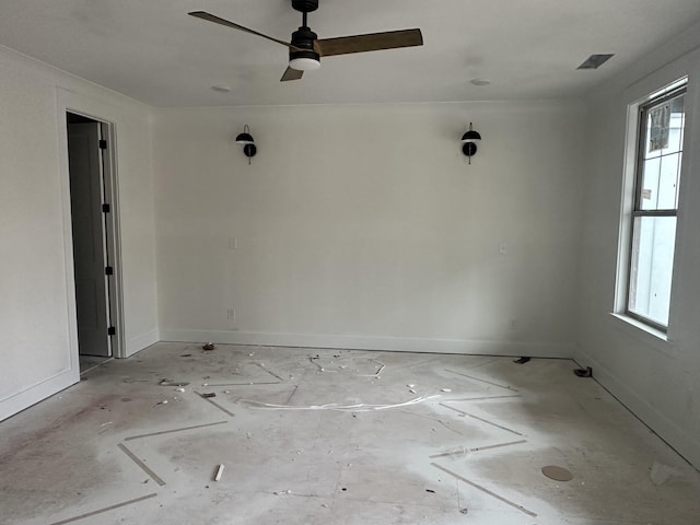 unfurnished room featuring plenty of natural light and ceiling fan