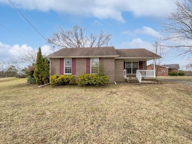 view of front of house featuring a front yard and covered porch