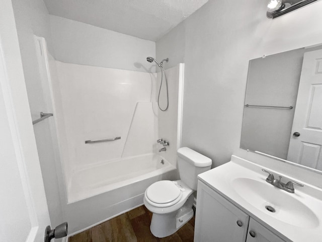 full bathroom with vanity, wood-type flooring, shower / bathtub combination, and toilet