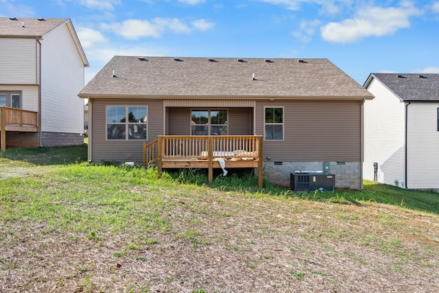 back of house featuring central AC unit, a yard, and a wooden deck