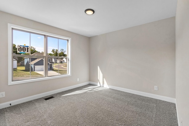 unfurnished room with carpet floors