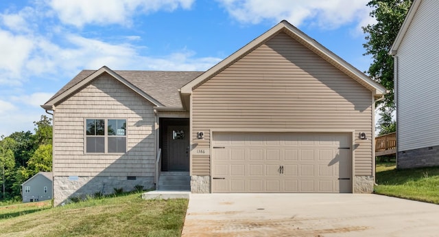 view of front of home with a garage and a front yard