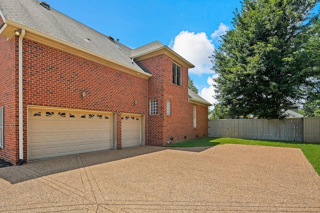 view of home's exterior with a garage