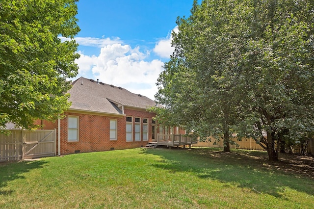 view of yard featuring a wooden deck