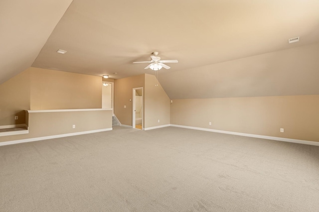 bonus room with ceiling fan, vaulted ceiling, and carpet