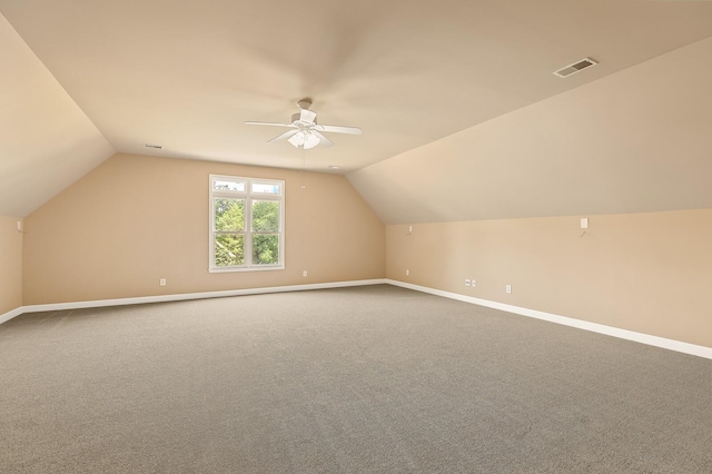 bonus room with ceiling fan, lofted ceiling, and carpet floors