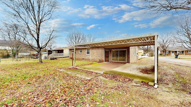 rear view of house featuring a carport