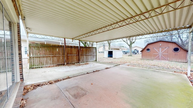 view of patio featuring a shed