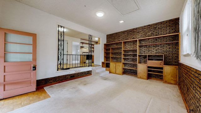 wine cellar with parquet floors and brick wall