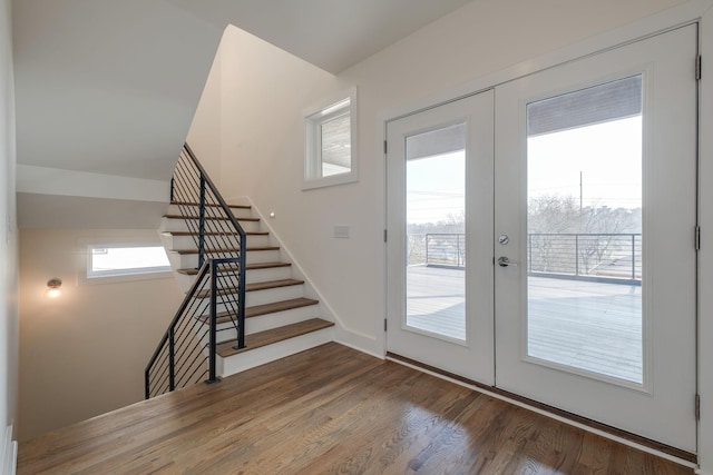 entryway featuring dark hardwood / wood-style floors and french doors