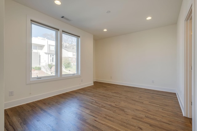 unfurnished room featuring dark wood-type flooring