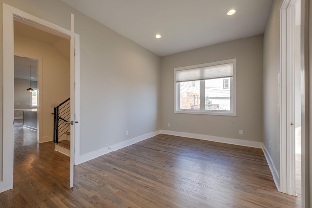 empty room with dark wood-type flooring