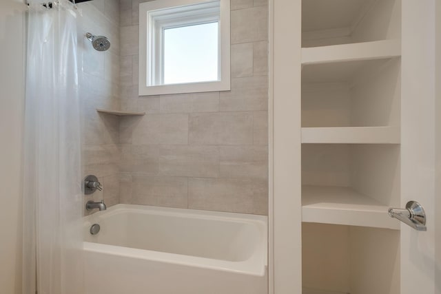 bathroom with shower / bath combo with shower curtain