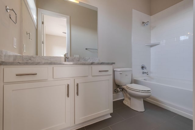 full bathroom featuring tiled shower / bath combo, vanity, tile patterned floors, and toilet