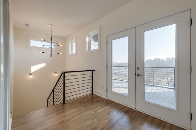 doorway to outside featuring hardwood / wood-style floors and french doors