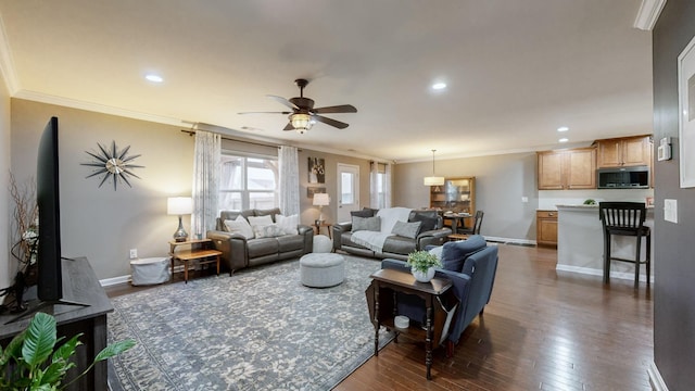 living room featuring ornamental molding, dark wood-type flooring, and ceiling fan