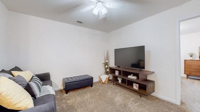 living room featuring ceiling fan and carpet floors