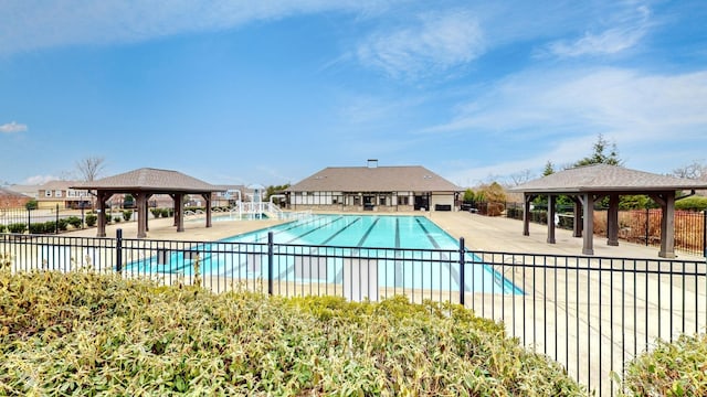 view of swimming pool with a gazebo and a patio area