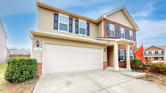 view of front of property with a garage